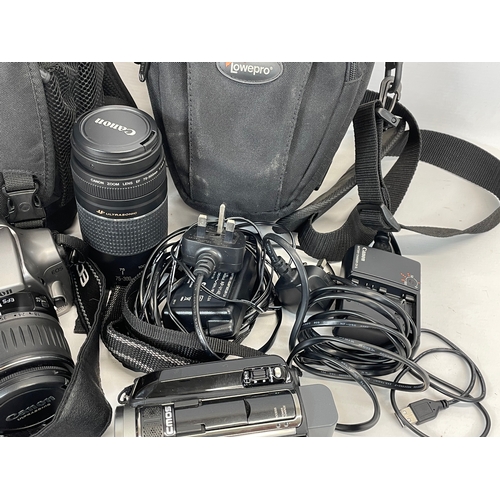 193B - 2 cameras and accessories in cases. Including a Canon EOS 300D, with lens, Yongnuo Speedlite YN560-I... 