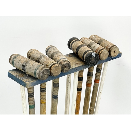 196E - A vintage Croquet set. 49x70cm