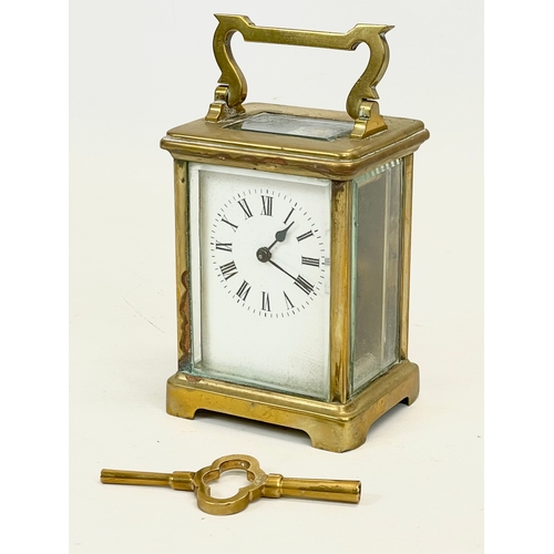 230 - A late 19th century French brass carriage clock by R & C Paris. with key. Working. 8.5x7x15cm includ... 