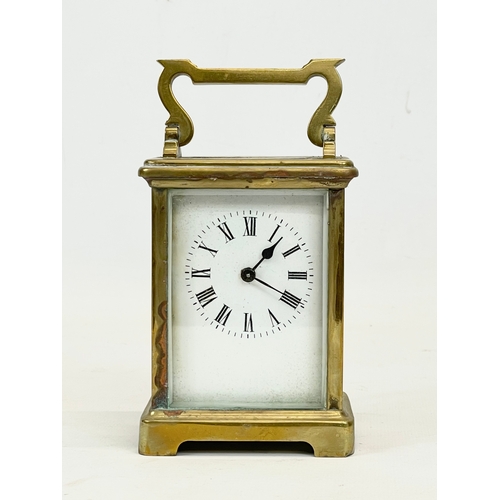 230 - A late 19th century French brass carriage clock by R & C Paris. with key. Working. 8.5x7x15cm includ... 