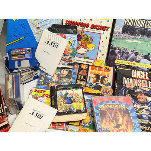 196I - A large quantity of Commodore Amiga games, Amiga floppy disks, Amiga magazines, etc.