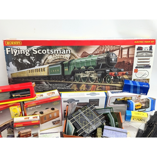 196L - A large collection of mostly Hornby Railways train models and tracks, including The Flying Scotsman ... 