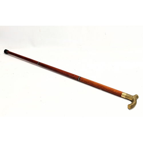 252 - A Victorian style walking cane with glass alcohol vile inside. 88.5cm