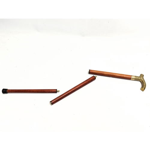 252 - A Victorian style walking cane with glass alcohol vile inside. 88.5cm