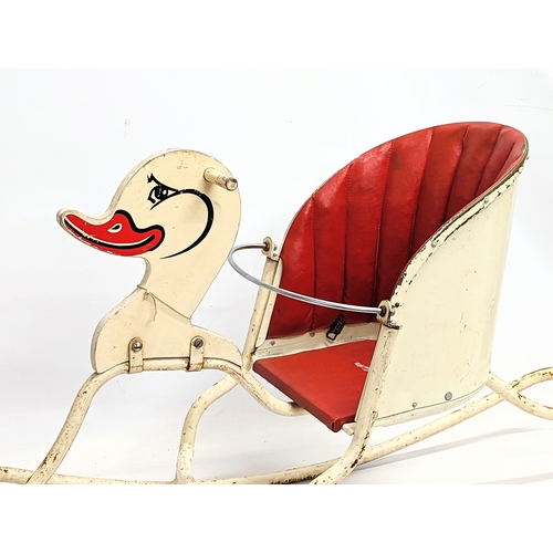 254 - A vintage child's rocker. 91x32x51cm