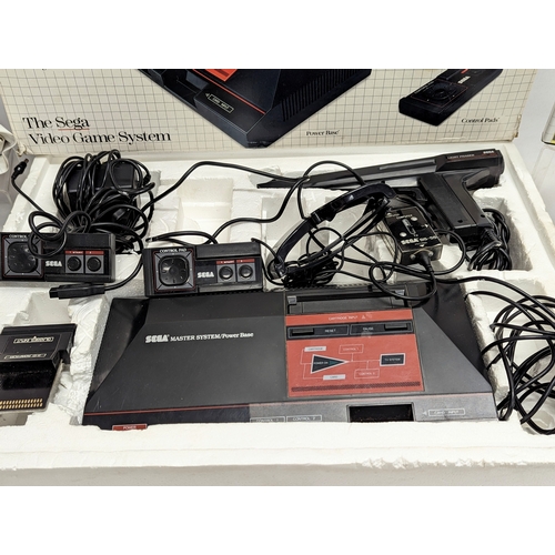 196N - A complete vintage SEGA Super Video System, including power base, control pads, 3-D glasses, light p... 