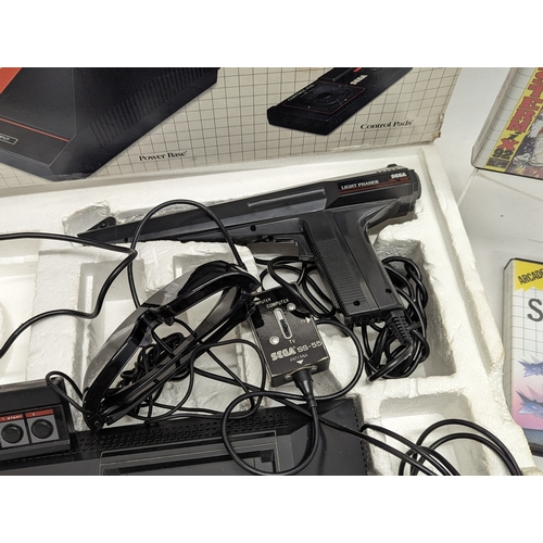 196N - A complete vintage SEGA Super Video System, including power base, control pads, 3-D glasses, light p... 