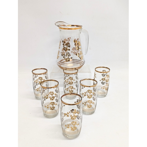 767 - A 1960s Mid Century glass drinking set. Glasses measure 12cm