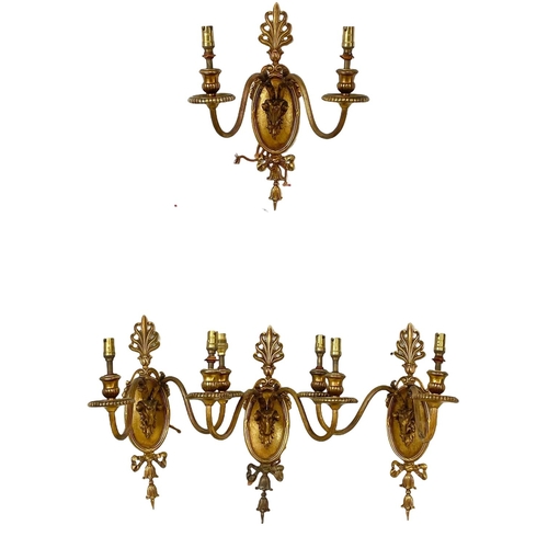 124 - A set of 4 early 20th century good quality ornate brass wall sconces. 26x35cm