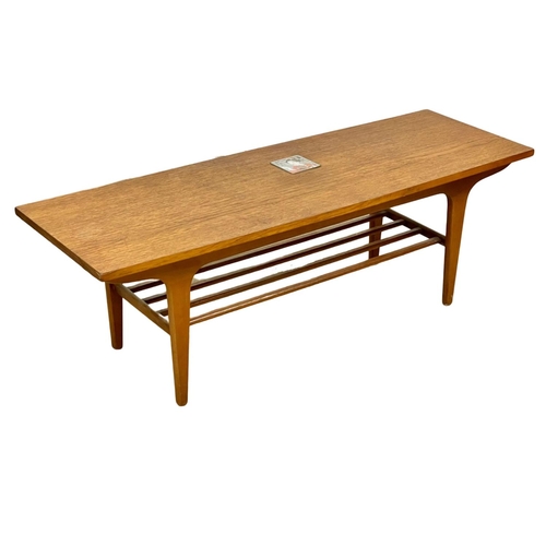 22 - A 1960’s Mid Century teak 2 tier coffee table. 122 x 38.5 x 40cm