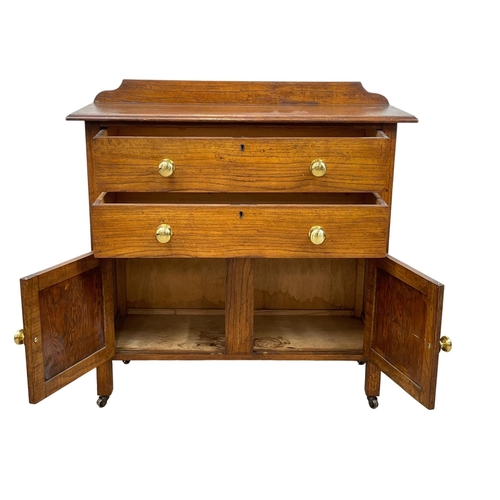 36 - A 1930’s oak chest of drawers, with 2 door cupboard. 84 x 33.5 x 85.5cm