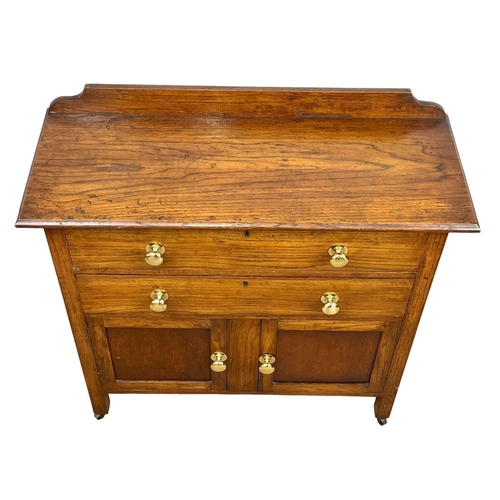 36 - A 1930’s oak chest of drawers, with 2 door cupboard. 84 x 33.5 x 85.5cm
