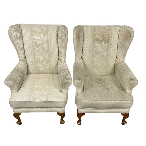 42 - A pair of vintage wingback armchairs. 75 x 79 x 100cm