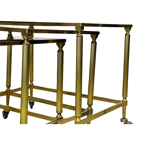 59 - A vintage brass framed nest of tables, with smoked glass top.