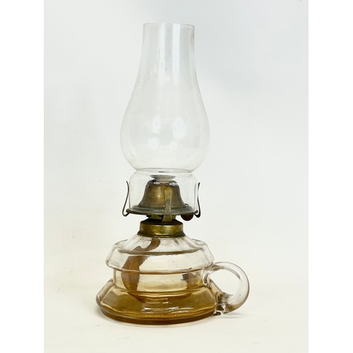 208A - A Victorian finger oil lamp. 26cm