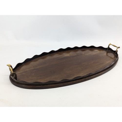 207B - An Edwardian mahogany serving tray. 67x32cm