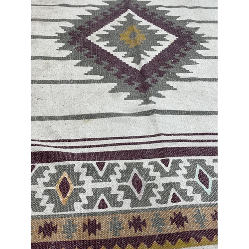83B - A Middle Eastern style rug. 112 x 178cm