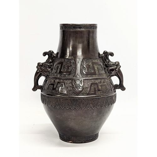 96A - A mid 19th century heavy bronze ornate vase. Qing dynasty, circa 1850. 21x26cm