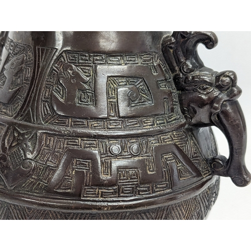 96A - A mid 19th century heavy bronze ornate vase. Qing dynasty, circa 1850. 21x26cm