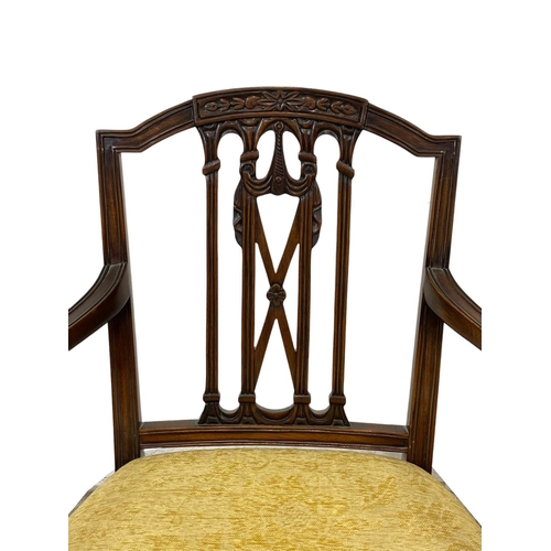 1026 - A pair of Hepplewhite style mahogany armchairs.