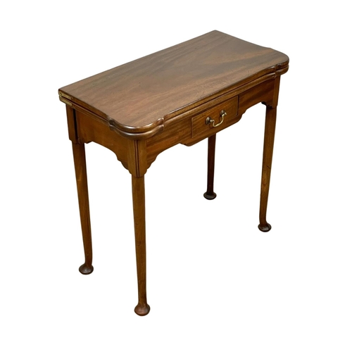 1029 - A late 19th century George II style mahogany turnover games table. Circa 1880. 75 x 36.5 x 73.5cm