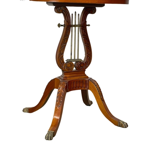 1027 - A Regency style Satinwood side table in the style of Duncan Fyffe. 60 x 45 x 70cm