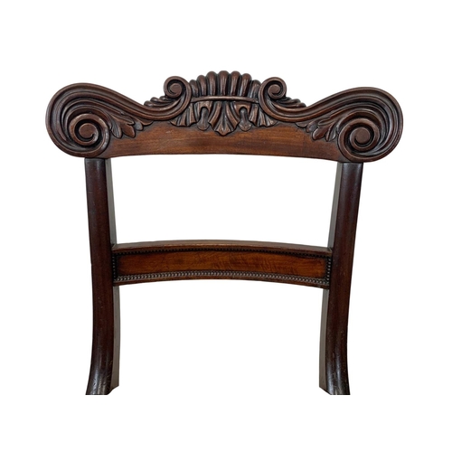 1033 - A pair of early 19th century William IV carved mahogany side chairs. Circa 1830.