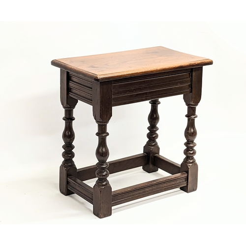 97A - An early 20th century oak join stool. 46x27.5x46.5cm