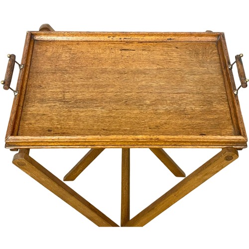 1042 - An Edwardian oak tray on stand. 59x45x83cm