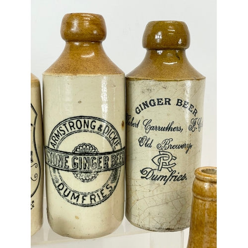 16 - A large collection of vintage Scottish stoneware ginger beer bottles. Including 5 Dumfries, W.G John... 