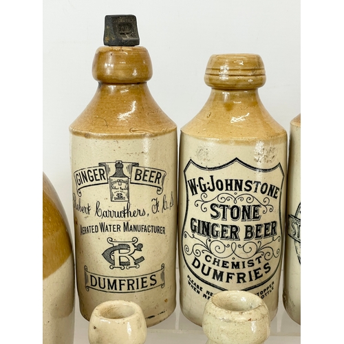 16 - A large collection of vintage Scottish stoneware ginger beer bottles. Including 5 Dumfries, W.G John... 