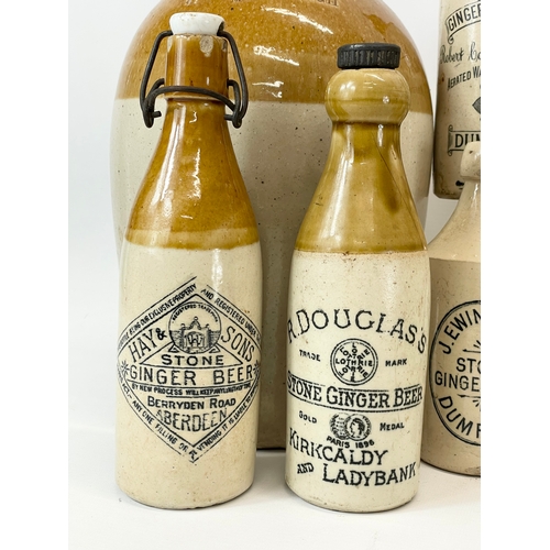 16 - A large collection of vintage Scottish stoneware ginger beer bottles. Including 5 Dumfries, W.G John... 