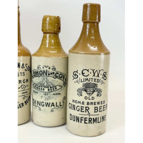 16 - A large collection of vintage Scottish stoneware ginger beer bottles. Including 5 Dumfries, W.G John... 