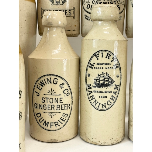 16 - A large collection of vintage Scottish stoneware ginger beer bottles. Including 5 Dumfries, W.G John... 