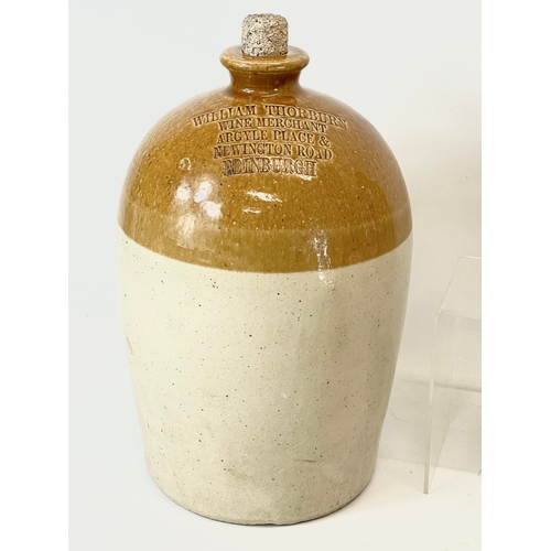 16 - A large collection of vintage Scottish stoneware ginger beer bottles. Including 5 Dumfries, W.G John... 