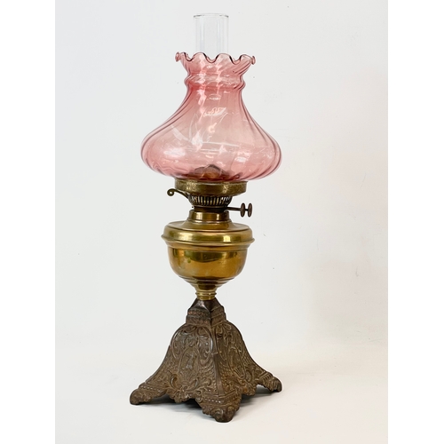 22 - A late Victorian double burner oil lamp. 57cm