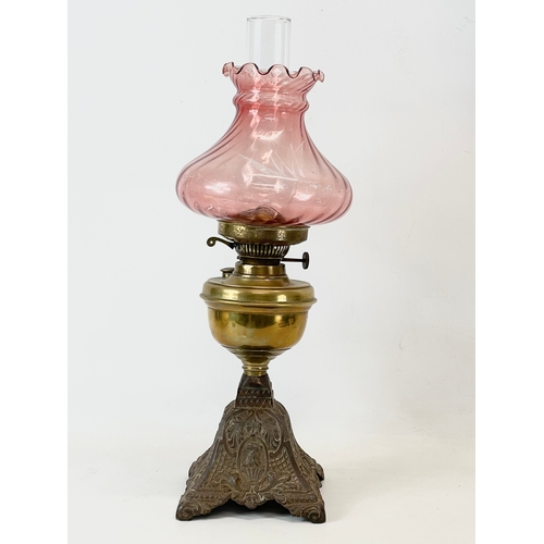 22 - A late Victorian double burner oil lamp. 57cm