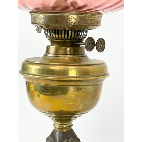 22 - A late Victorian double burner oil lamp. 57cm