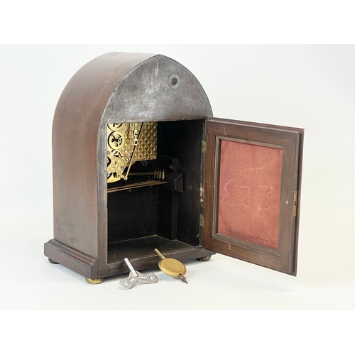 27 - A large Edwardian inlaid mahogany mantle clock. With key and pendulum.  26x16x36cm