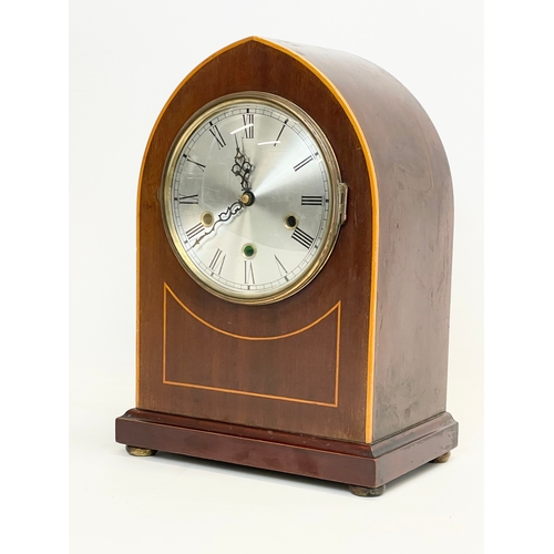 27 - A large Edwardian inlaid mahogany mantle clock. With key and pendulum.  26x16x36cm