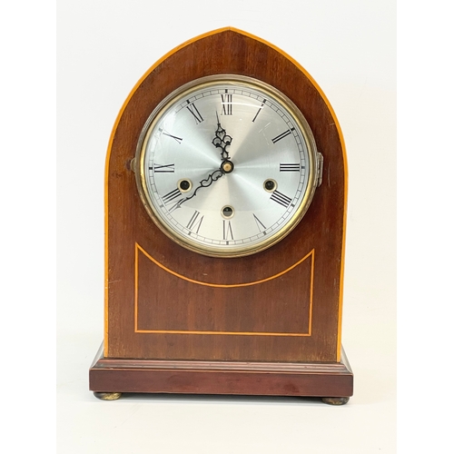 27 - A large Edwardian inlaid mahogany mantle clock. With key and pendulum.  26x16x36cm