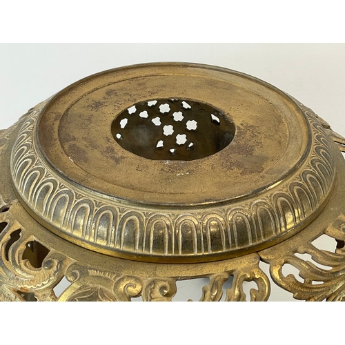 29 - A heavy ornate brass plantstand. 39x37cm