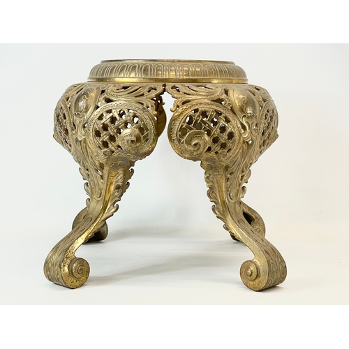 29 - A heavy ornate brass plantstand. 39x37cm