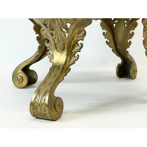 29 - A heavy ornate brass plantstand. 39x37cm