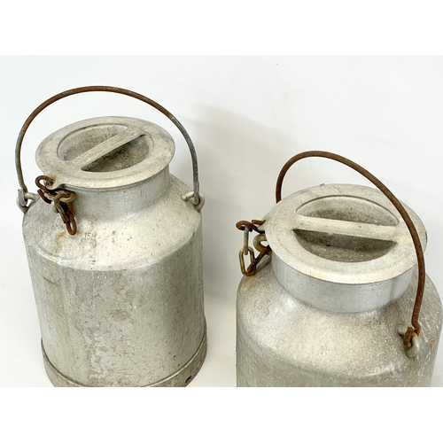 31 - A pair of vintage milk churns. 40cm