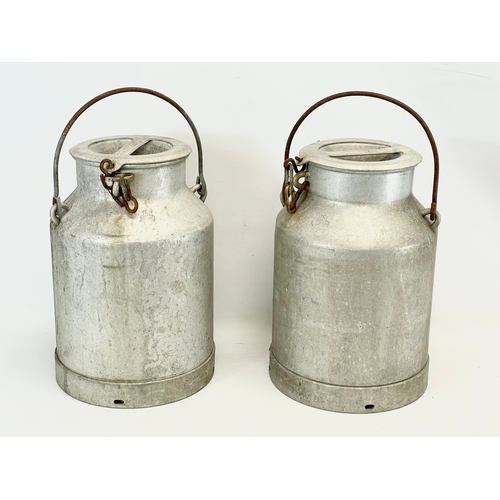 31 - A pair of vintage milk churns. 40cm