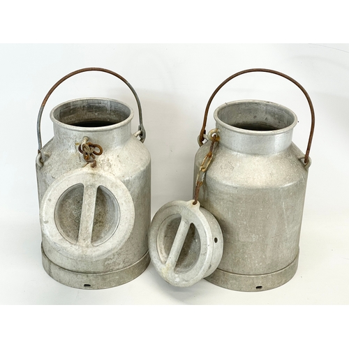 31 - A pair of vintage milk churns. 40cm