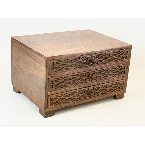 32 - An Indian padauk wood table top chest with 3 drawers. 35x25.5x21cm