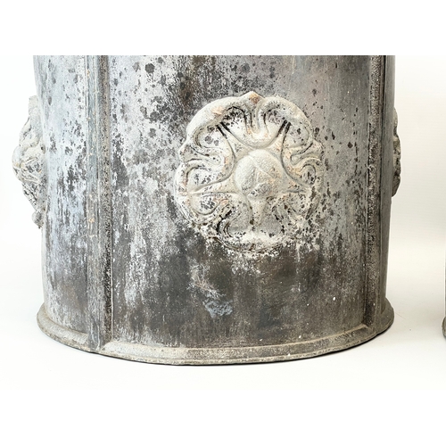 34 - A pair of late 19th/early 20th century heavy lead planters, with English Rose decoration. 35x30cm