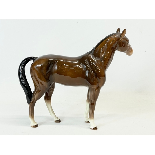 392 - A large Sylvac pottery horse. 27x22.5cm